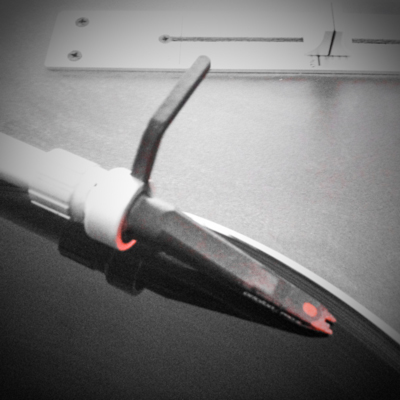 Photo by Ian Campbell of a Vestax PDX-A1s turntable and an Ortofon Concorde headshell with stylus.